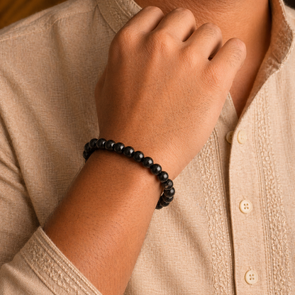 Person wearing a black tourmaline bracelet