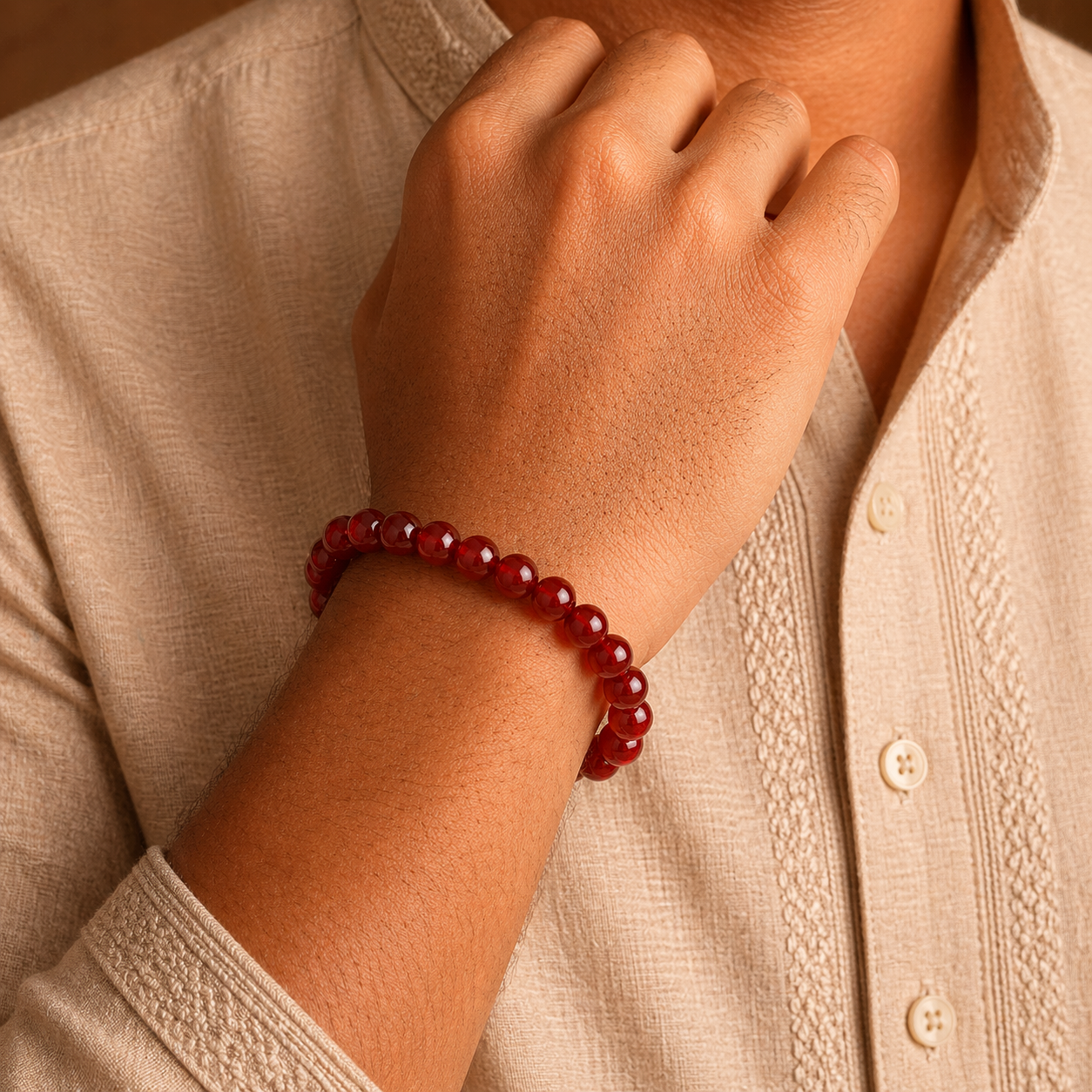 Man wearing a carnelian bracelet