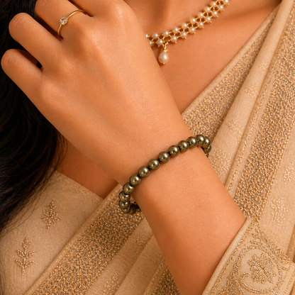 Close-up of a woman wearing a pyrite bracelet